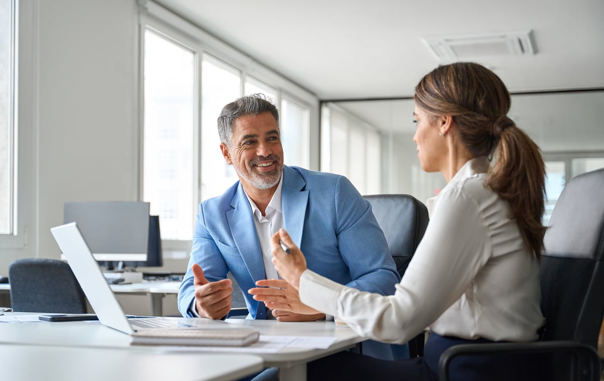 Experienced professional speaking with confidence in the workplace
